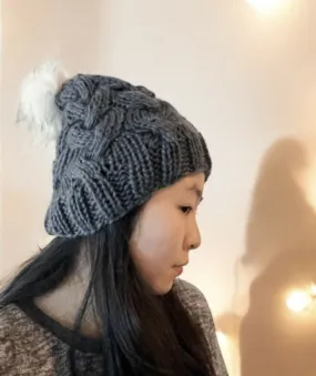 Cable Hand Knit Slouchy Beanie in Dark grey with white fur pompom