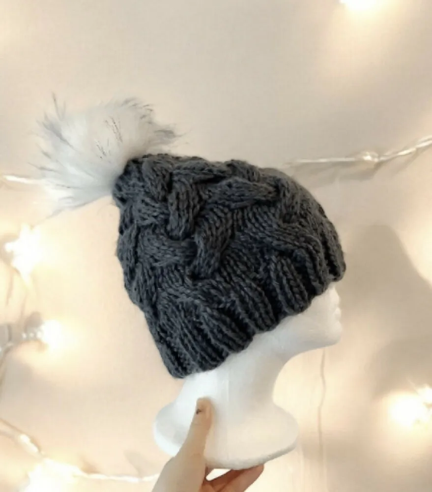 Cable Hand Knit Slouchy Beanie in Dark grey with white fur pompom